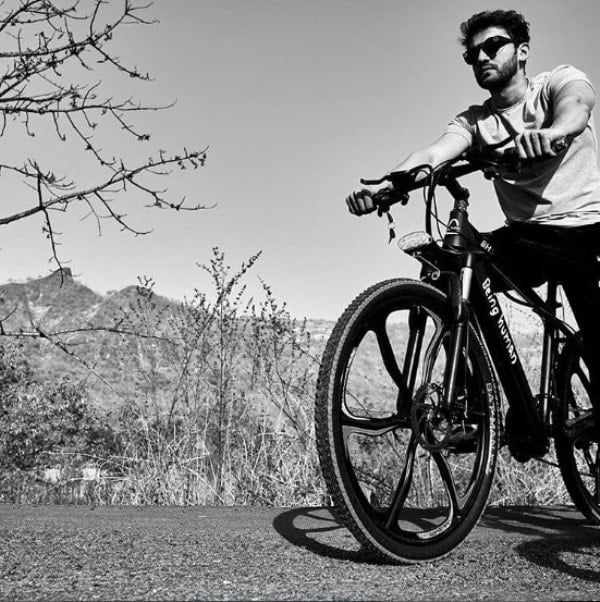 Zaheer Iqbal riding a bicycle