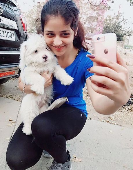 Priyanka Jawalkar taking selfie with her pet dog