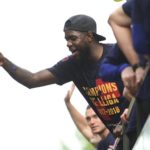 Samuel Umtiti pouring beer over journalists