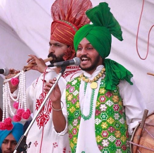 Davi Singh participating in Bhangra and Boliyan competition during his college function
