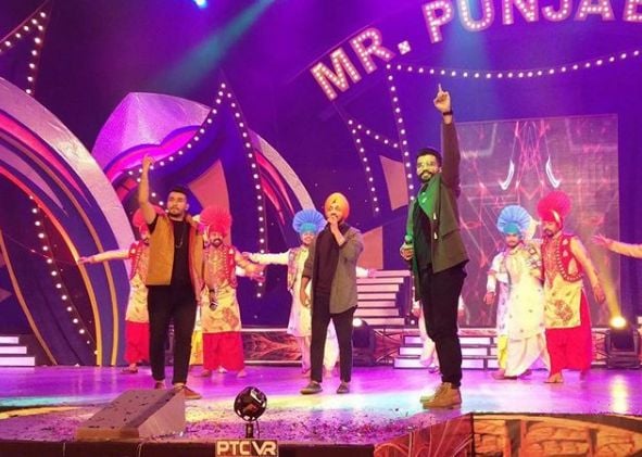 Guri Singh performing with his partners at Mr. Punjab 2016