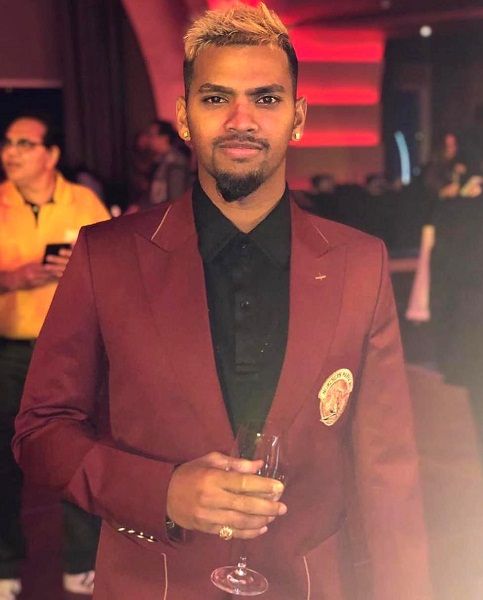 Nicholas Pooran with a glass of wine