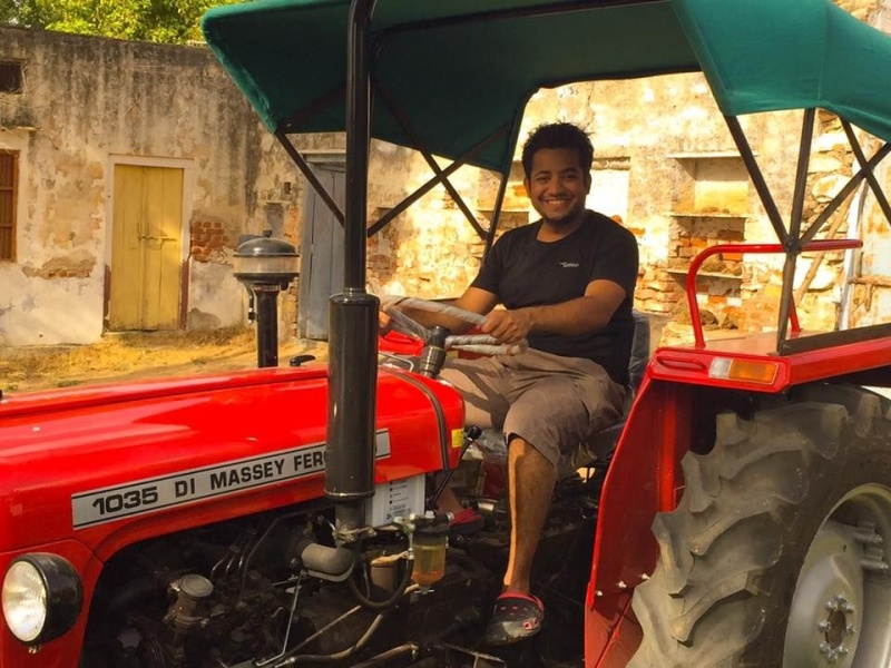 Roman Saini Driving A Tractor