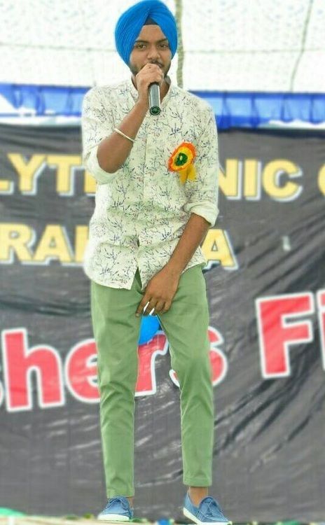 Satbir Aujla singing during his college function