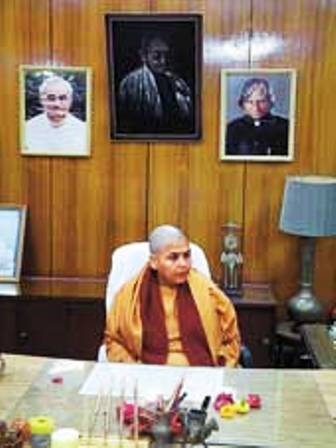 Uma Bharti sitting in the Madhya Pradesh CM office