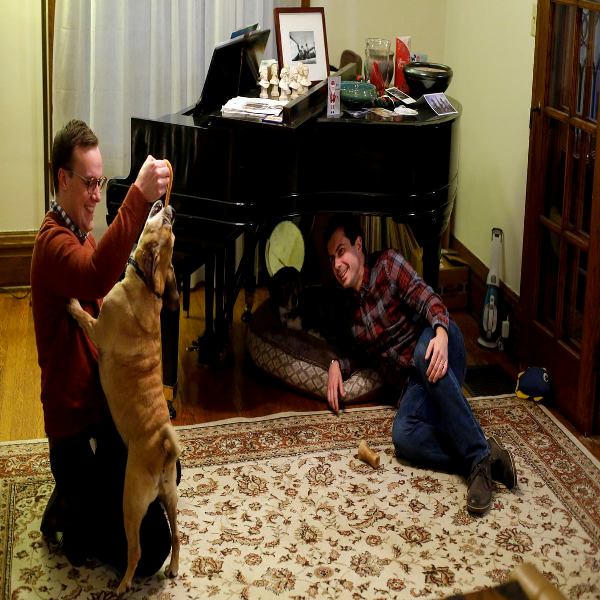 Pete Buttigieg And Chasten Glezman Playing With Their Dogs