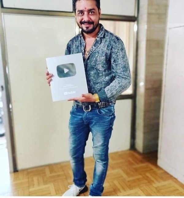 Hindustani Bhau Showing His YouTube Silver Play Button