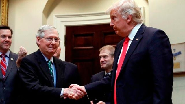 McConnell shaking hand with Donald Trump
