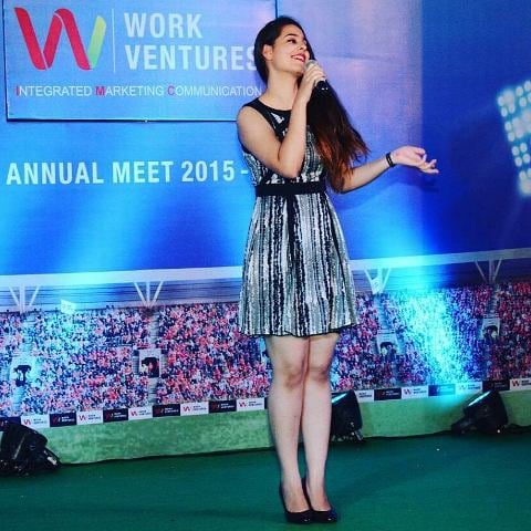 Anusha Mishra hosting the annual conference at her previous job, at Work Ventures