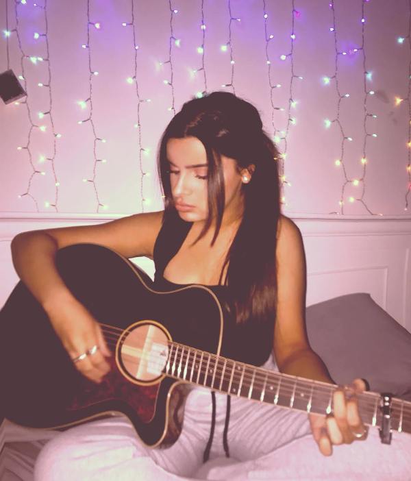 Celina Sharma Playing the Guitar
