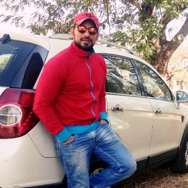 Hrishikesh Pandey Posing with His Car
