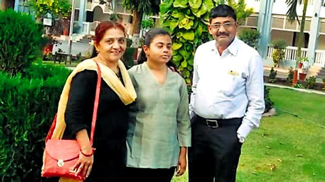 Pranjal Patil with her parents