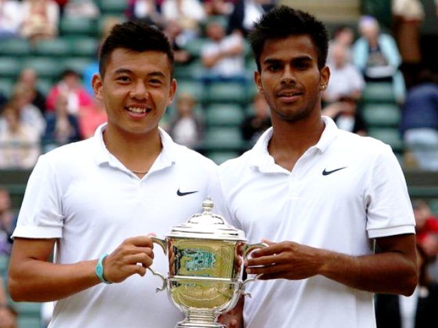 Sumit Nagal with Lý Hoàng Nam after winning the boys' doubles at Wimbledon