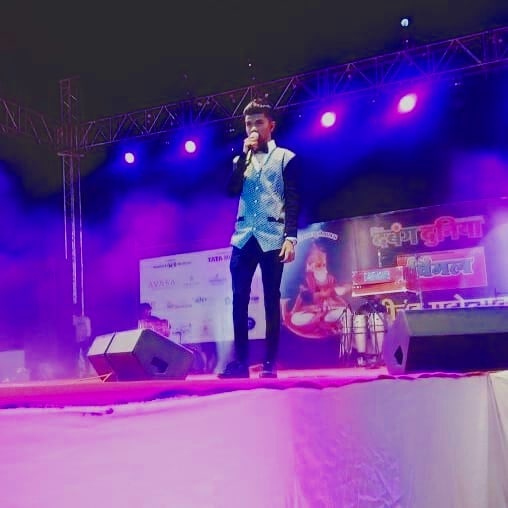 Azmat Hussain performing on a stage show