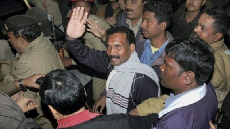 Madhu Koda after being arrested