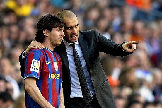 Lionel Messi with Pep Guardiola
