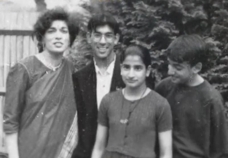 A young age image of Rishi Sunak with his mother and siblings