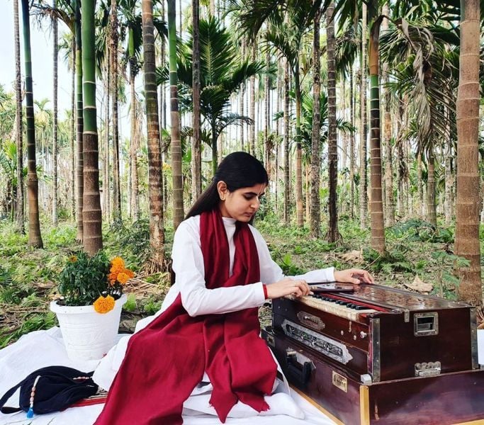 Devi Chitralekha Playing Harmonium