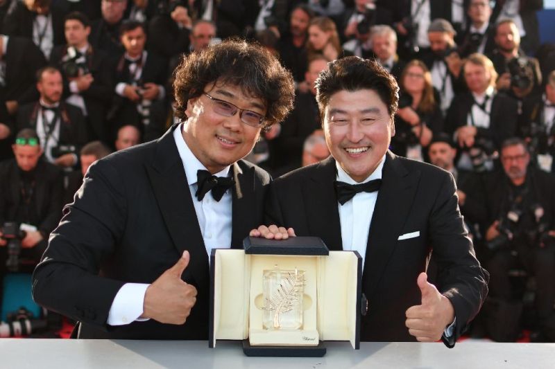 Song Kang-ho and Bong Joon-ho with Palme d'Or at the Cannes Film Festival