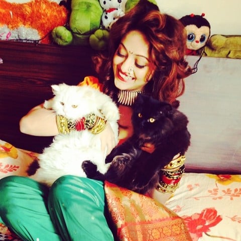 Manasi Naik playing with a cat