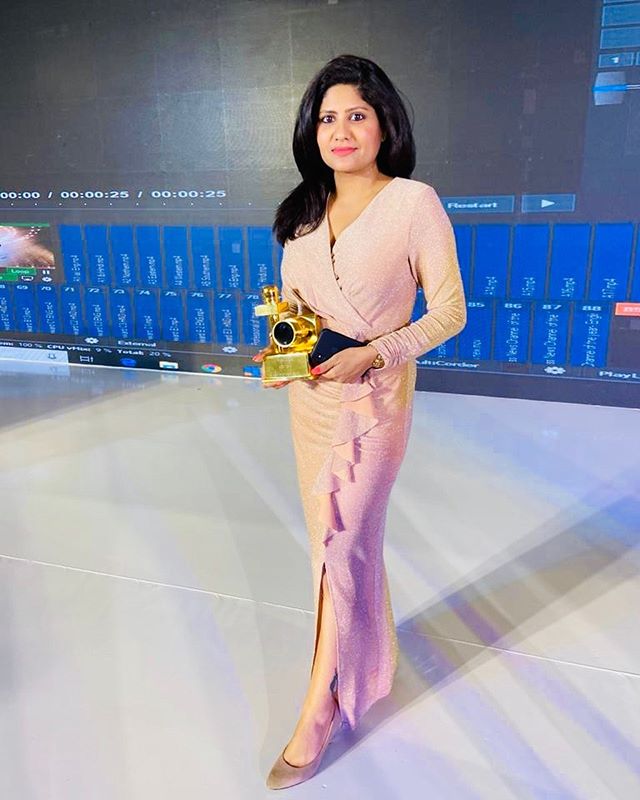 Kumkum Binwal with her award 