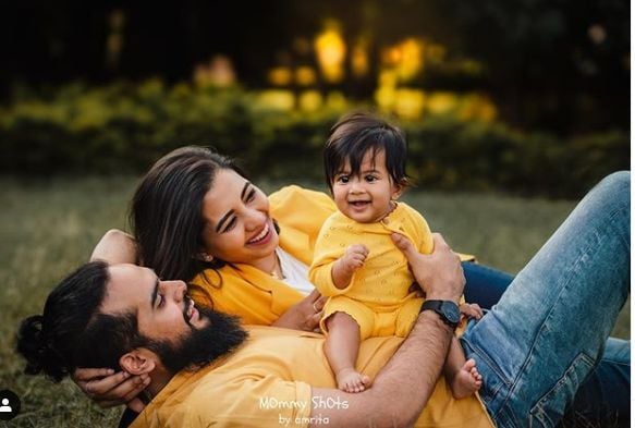 Disha Madan with her husband and son