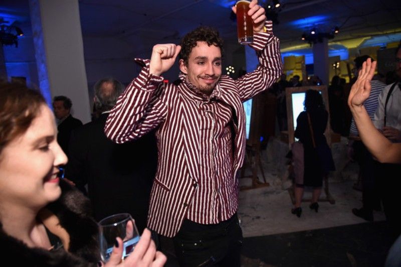 Robert Sheehan enjoying alcohol in a party
