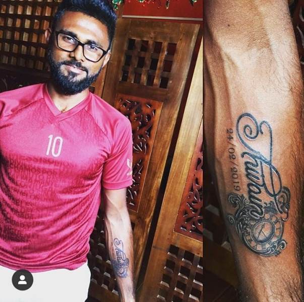Isuru with the tattoo of his daughter's name on his forearm