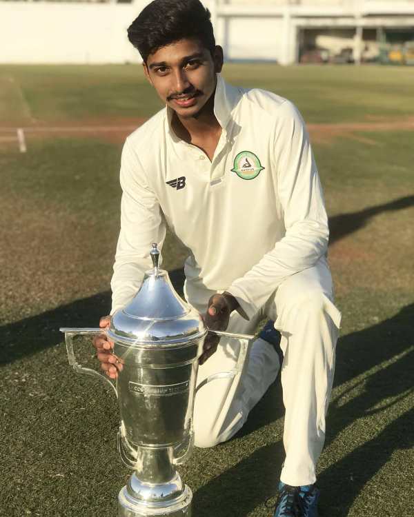 Darshan Nalkande with the Cooch Behar Trophy