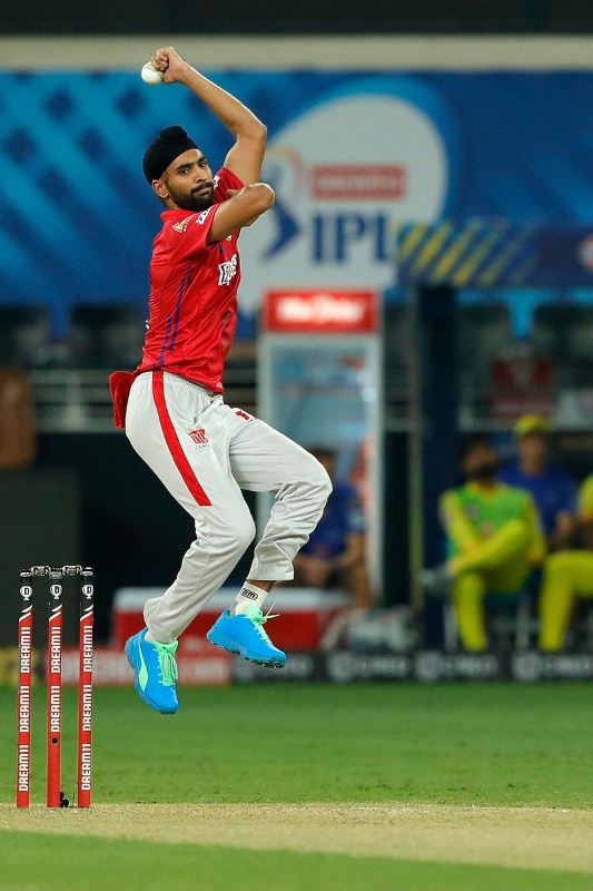 Harpreet Brar bowling during an IPL match