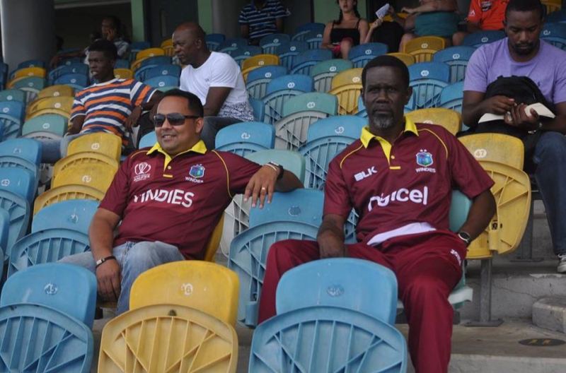 Keemo Paul's father with Safraz Sheriffudeen during a test match in Barbados