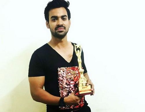 Aditya Ojha with his Award
