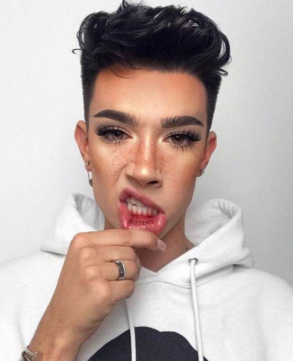 James Charles showing his lip tattoo