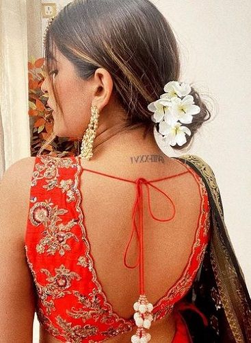 Kritika Khurana's tattoo on neck