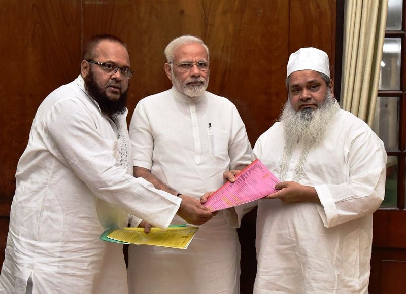 Maulana Badruddin along with his brother Mohammad Sirajuddin Ajmal presenting a memorandum to Honourable PM Modi highlighting several issues concerned with Assam