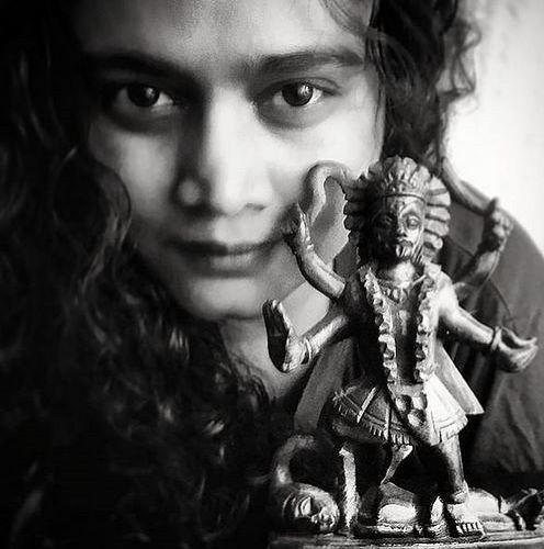 Kalyanee Mulay with an idol of goddess Kaali