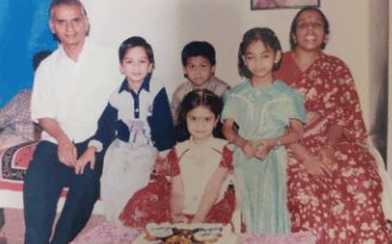 A childhood photo of Manasa Varanasi with her parents and siblings