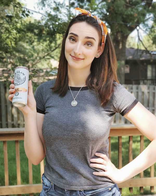 Abigail Shapiro drinking Hard Seltzer, an alcoholic seltzer
