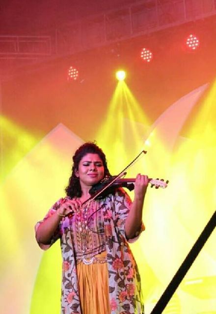 Lekshmi Jayan playing a violin