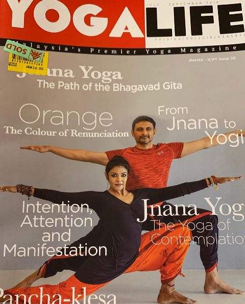 Sandhya Manoj and her husband on the cover of Yoga Life magazine