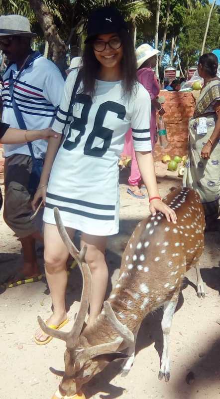 A picture of Mansi with a Chital deer