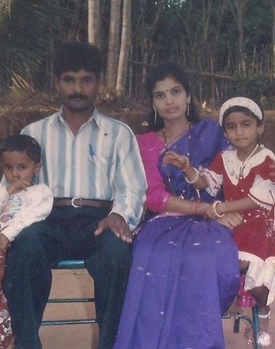 An old photo of Divya Suresh (sitting with her mother) with her family 