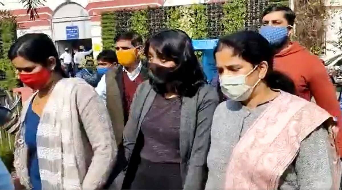 Disha Ravi being taken away by the Delhi Police officials after getting arrested in the 'toolkit case'