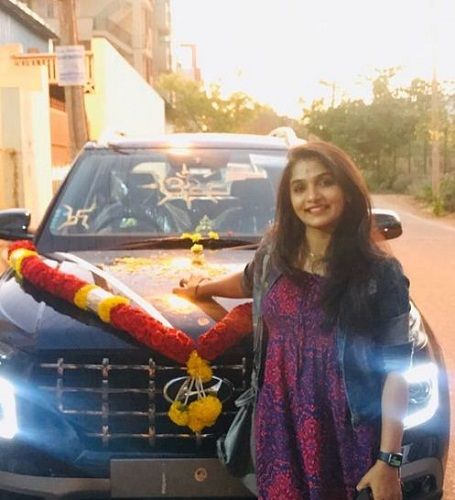 Divya Suresh with her car