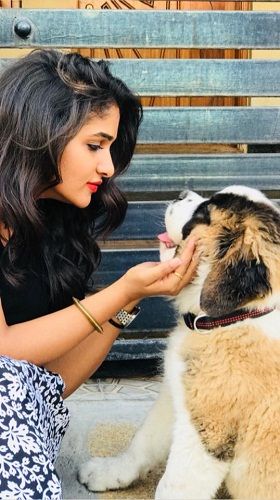 Divya Suresh with her pet dog