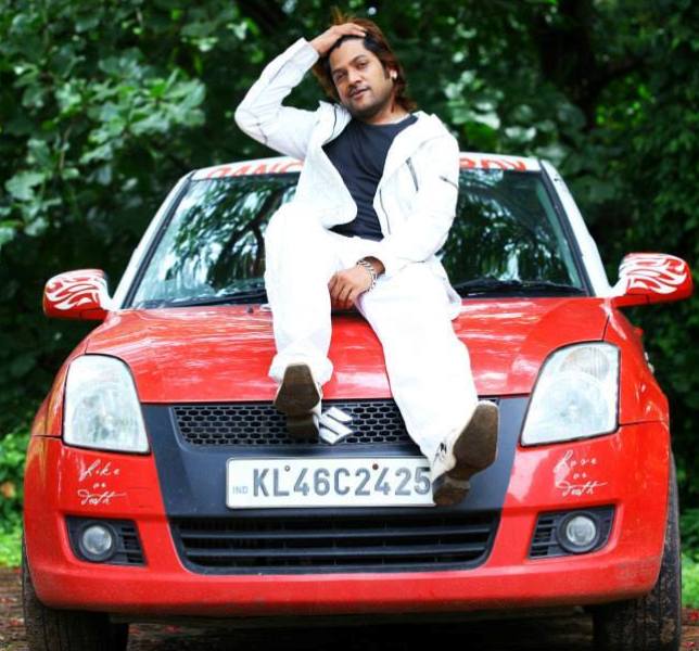 Firoz Khan sitting on his car