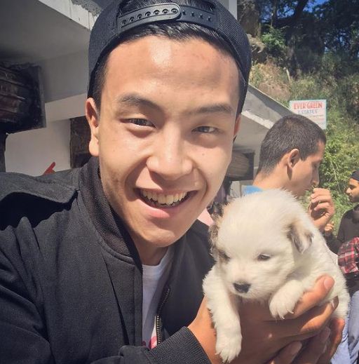 Gary Lu with a dog