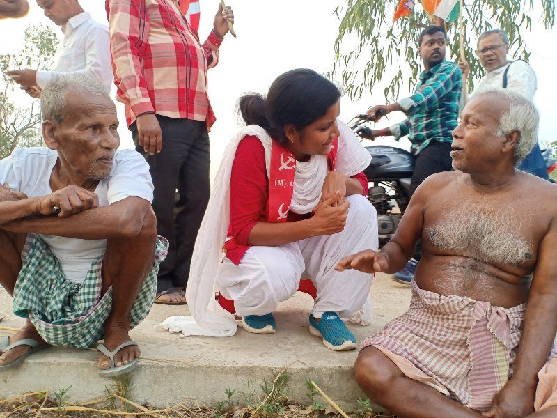 Minakshi Mukherjee listening to villagers