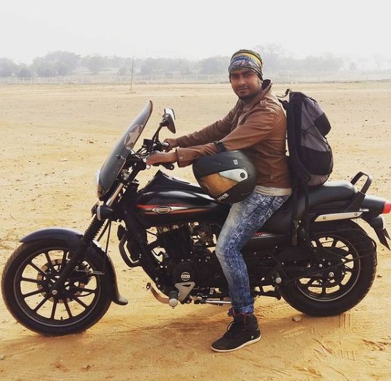 Raghu Gowda posing with his bike