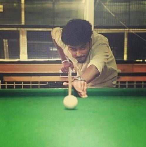 Shamanth Gowda playing snooker